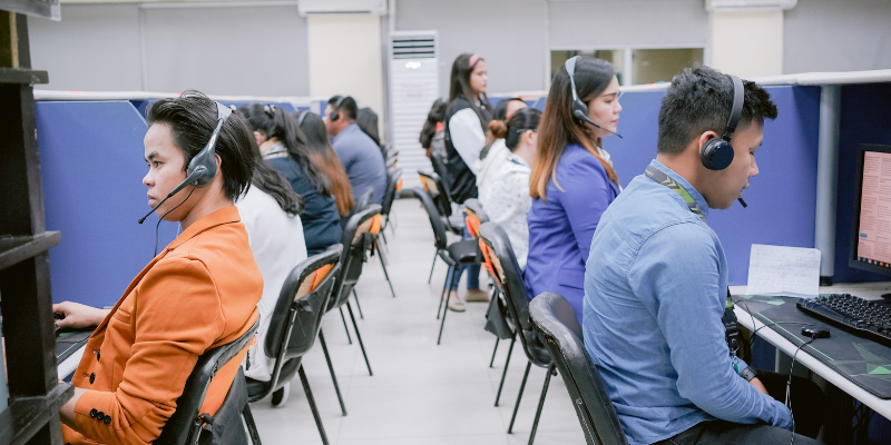 a group of telemarketers working in an office