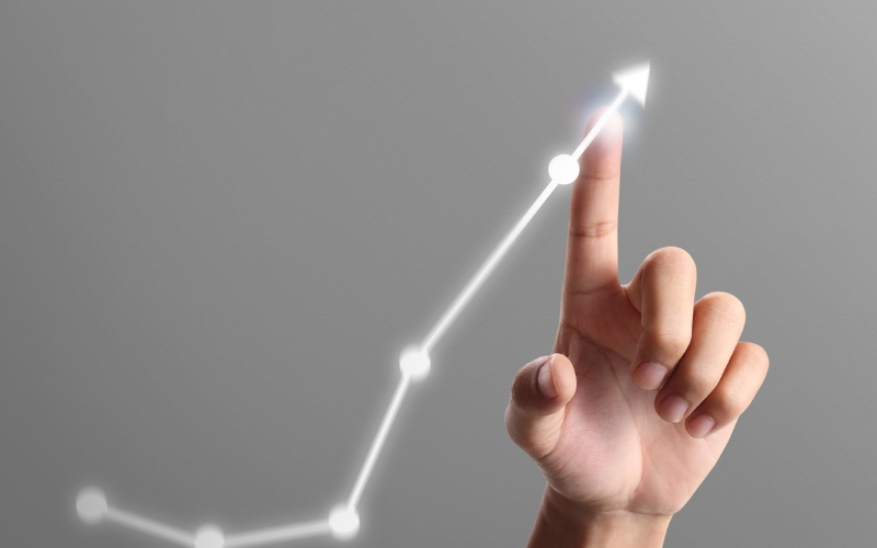 a hand following a white line graph