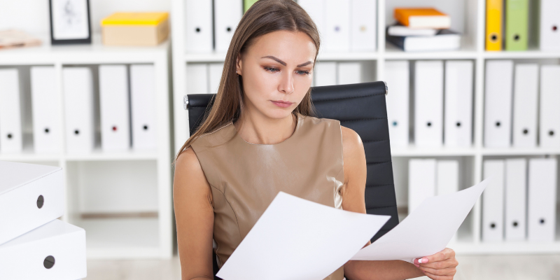 A woman reading a document