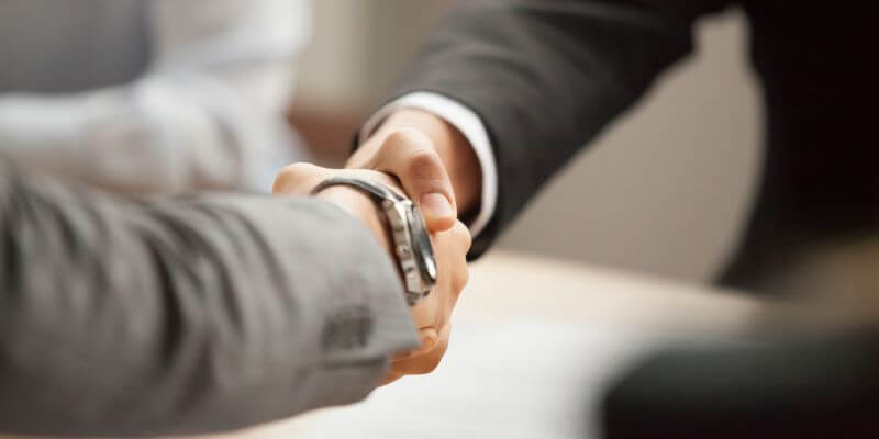 two people shaking hands