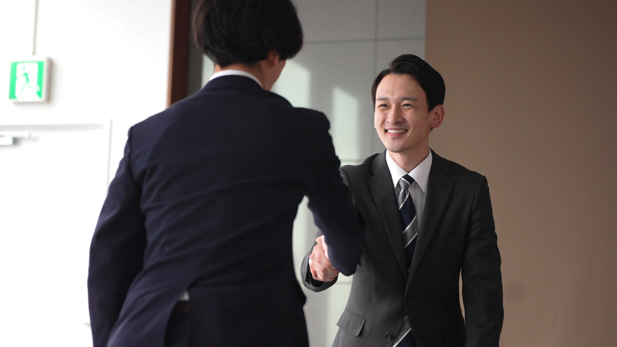 Two BPO employees shaking hands