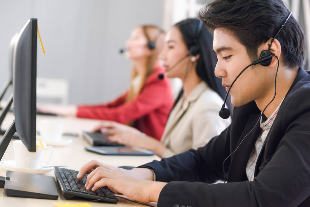 a group of telemarketers working