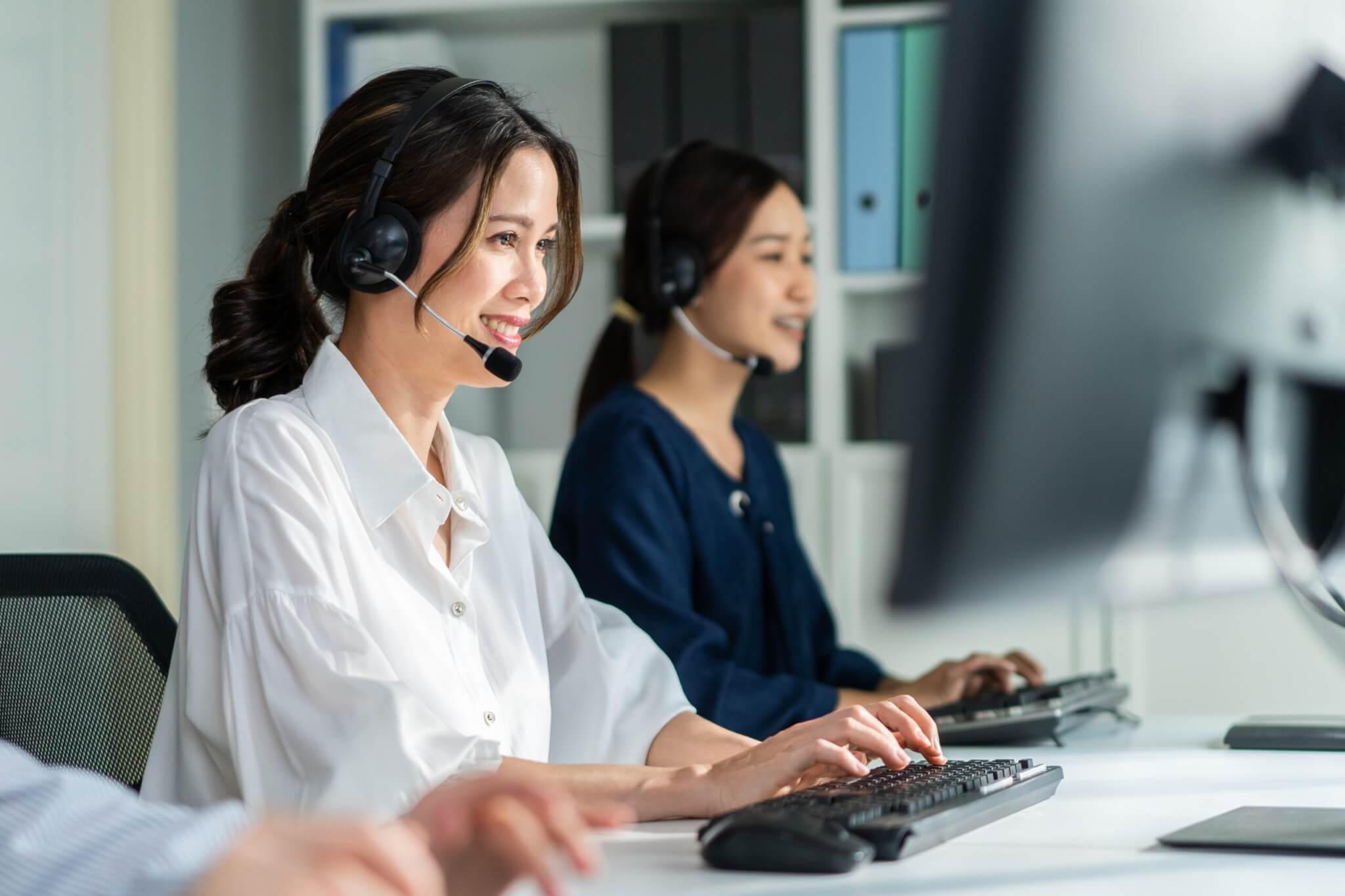 two telemarketers working