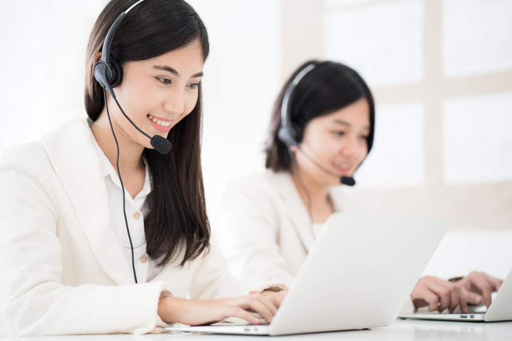 two telemarketers working