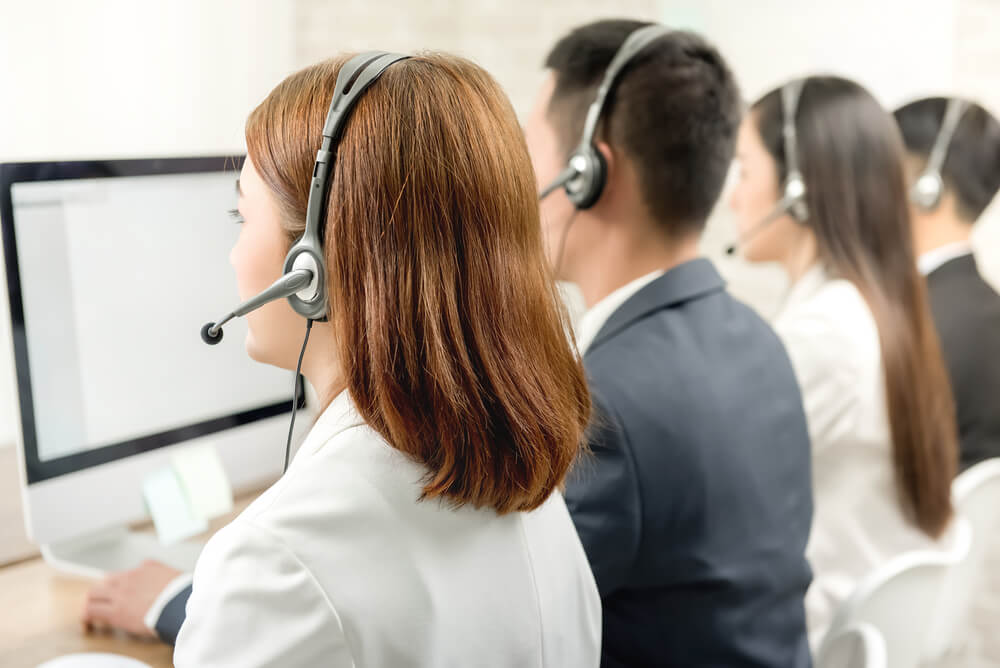 Back,View,Of,Asian,Telemarketing,Customer,Service,Agent,Team,,Call