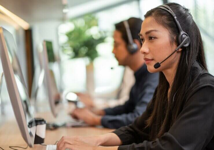 Asian,Call,Center,Team,,Customer,Service,,Telesales,Wearing,Headset,Or