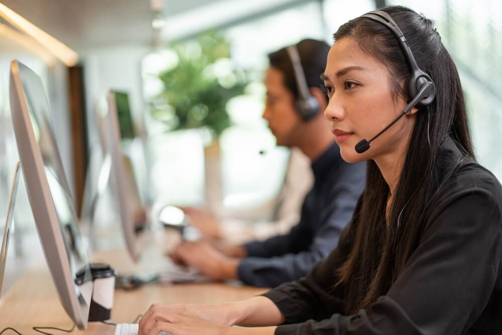 Asian,Call,Center,Team,,Customer,Service,,Telesales,Wearing,Headset,Or